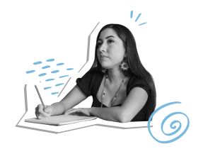 A woman sitting at a desk with a pen and paper in front of her.